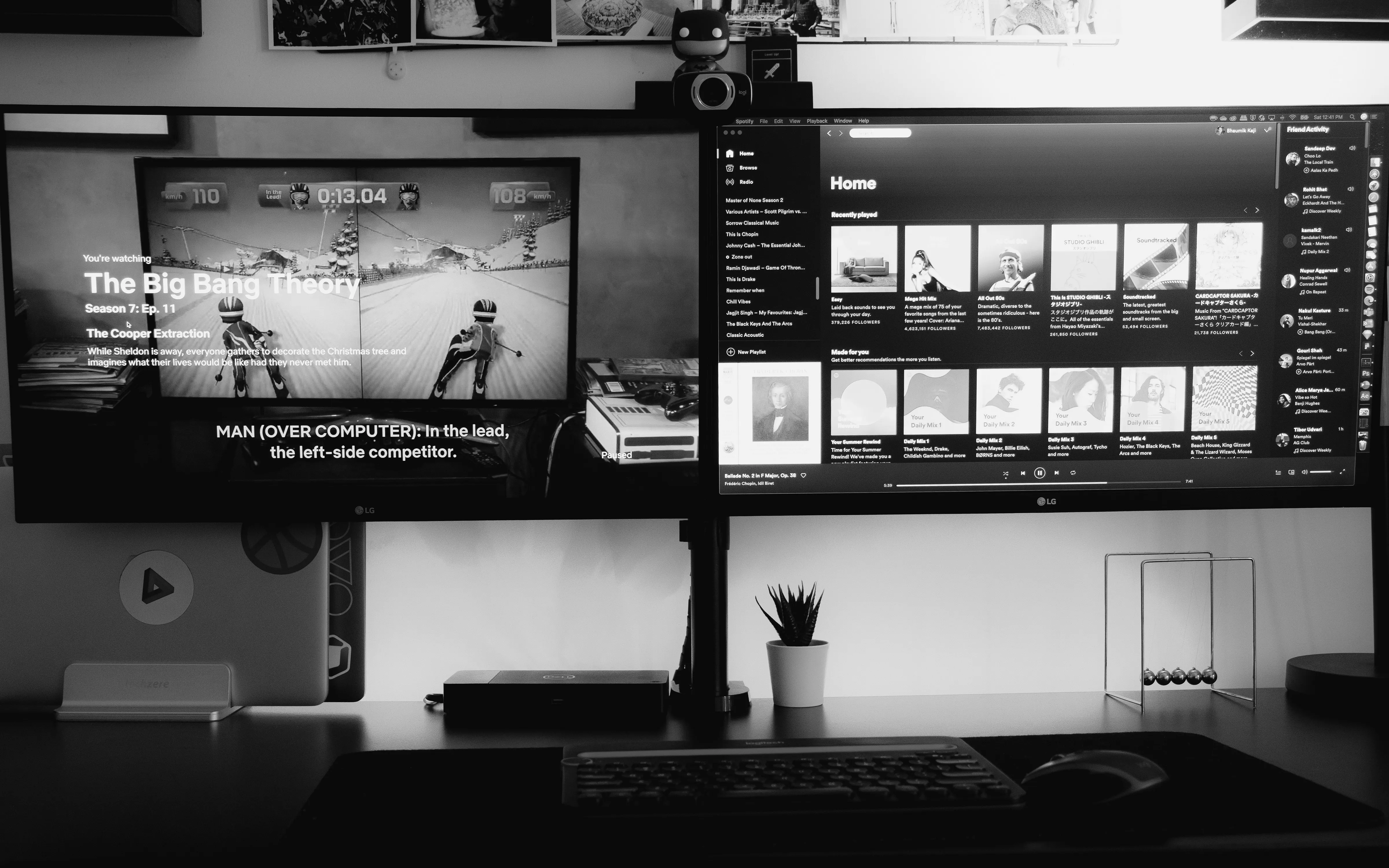 Screen one is showing Netflix in Fullscreen and screen two is showing Spotify in Fullscreen mode.